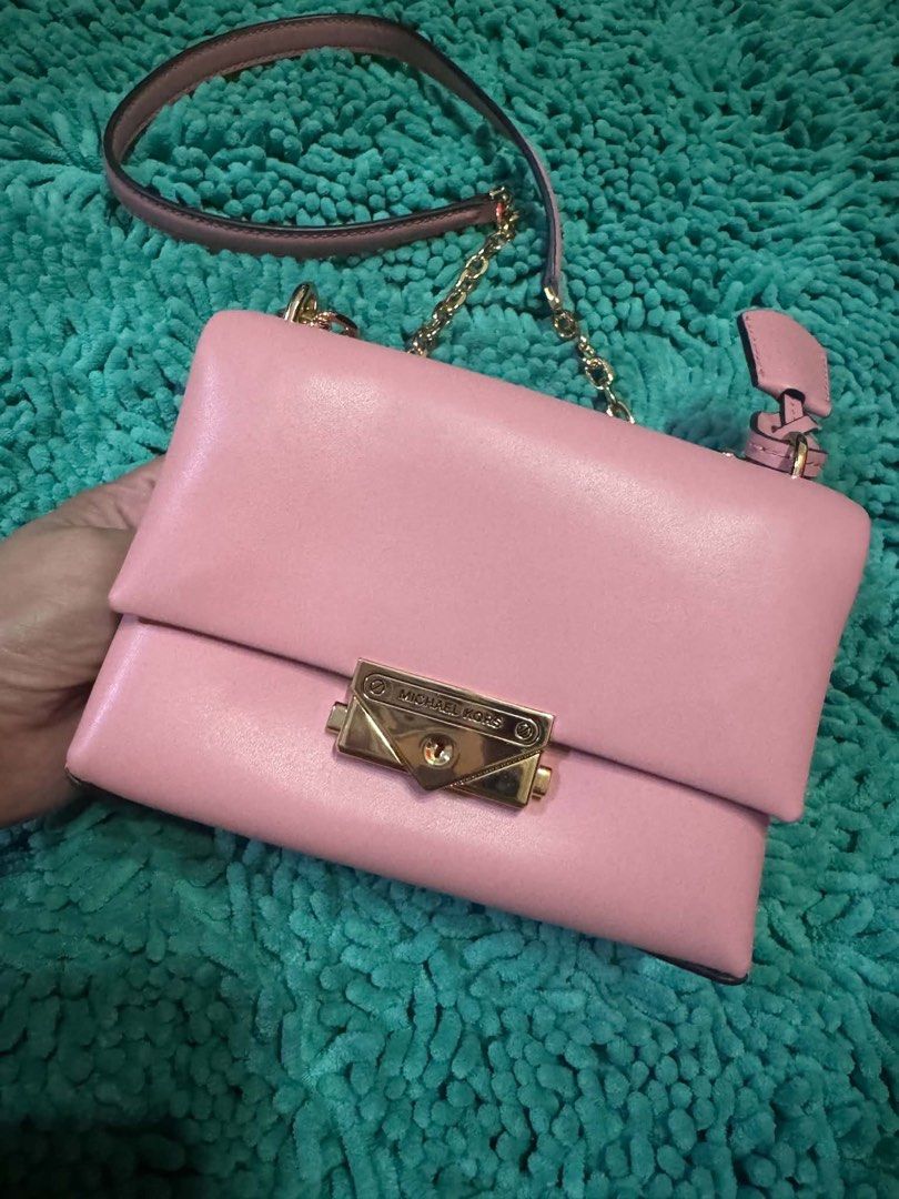 Michael Kors Cece Small Conv Flap Xbody Primrose (Category: Luxury Bags & Wallets) located in Manila. Submitted by belle_gray (Listing ID 1465512384, Image 3). Description: - Brand: Michael Kors Cece Convertible Crossbody - Color: Primrose Pink - Material: Premium vegan leather with gold-tone hardware - Closure: Secure envelope lock - Strap: Versatile chain and leather strap - Inclusions: Brand new with $448 store tag, care card, and original MK 