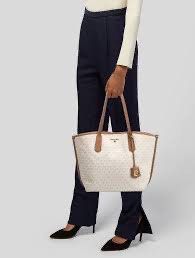 Michael Kors Jane Large Tote Bag Monogram Vanilla (Category: Tote Bags) located in Legazpi City. Submitted by Tagged_phl (Listing ID 1465491375, Image 3). Description: With flaws but can be easily fixed. With minor dents on the leather and hardware. Bought from Bee Klassik (fb).
