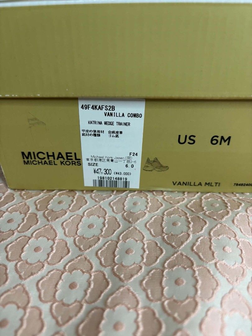 Michael Kors Katrina Wedge Trainer Vanilla Combo Size US 6M (Category: Sneakers) located in Bayombong. Submitted by rnstrifty (Listing ID 1465571272, Image 3). Description: - Brand: Michael Kors - Style: Katrina Wedge Trainers - Color/Print: Vanilla Combo (Signature MK monogram, gold & silver metallic snake print, white leather texture) - Size: US 6M - Features: Trendy chunky platform sole with rubber grip - Inclusion: Comes with original Michael