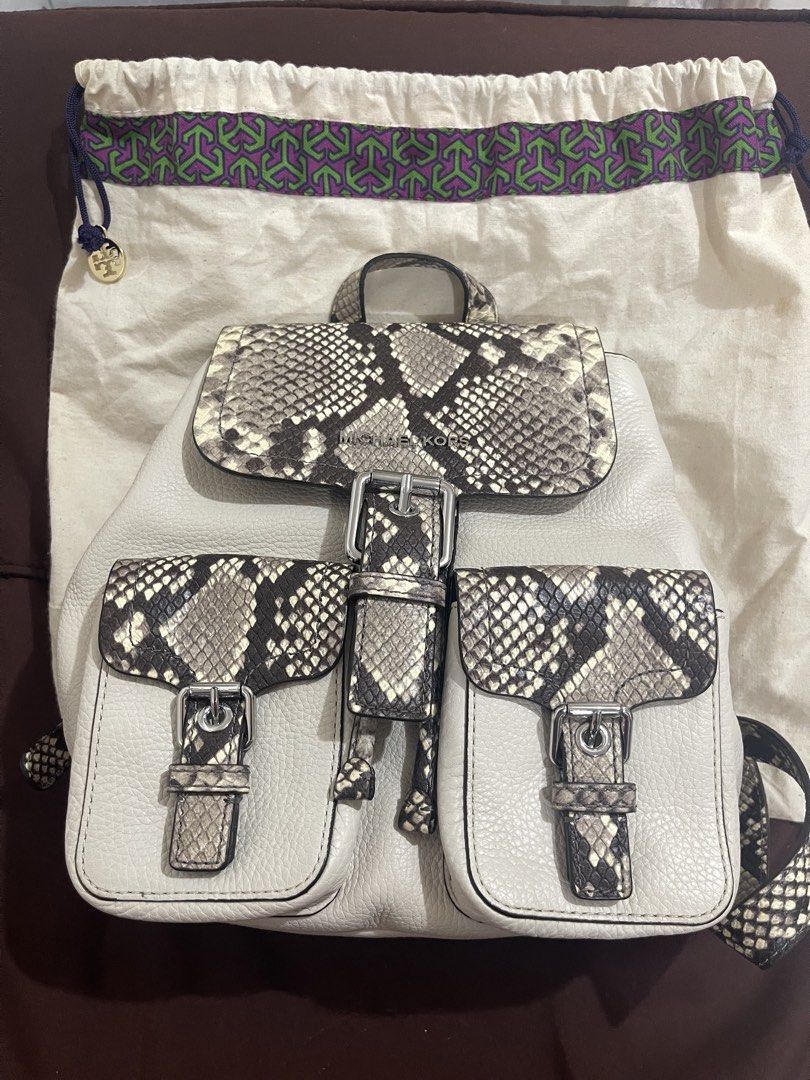 !!!RUSH!!!Michael Kors Python Print Leather Backpack (Category: Backpacks) located in Manila. Submitted by sunflowermama904 (Listing ID 1465444288, Image 3). Description: - Brand: Michael Kors - Material: Premium cream pebble leather with snakeskin print panels - Closure: Flap front with buckle and inner drawstring - Pockets: Two convenient exterior front pockets - Hardware: Silver-tone with branded interior lining - Extras: Includes original dus