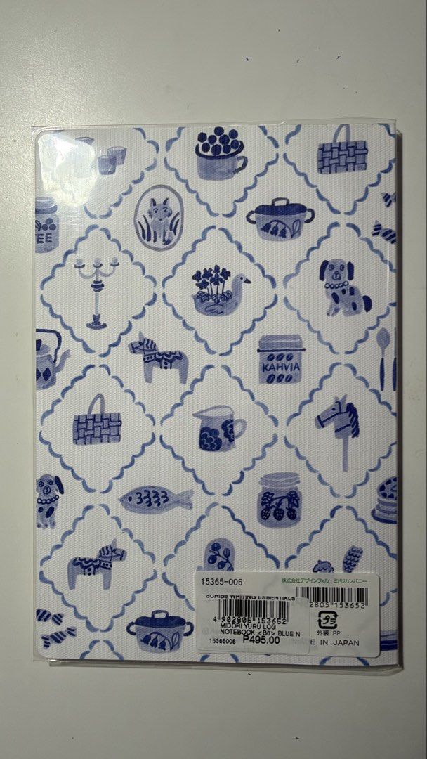 Midori Yuru Log Notebook B6 Blue (Category: Stationery & School Supplies) located in Rizal. Submitted by artandjournals (Listing ID 1465567928, Image 2). Description: - Brand: Midori (Designphil) - Style: Yuru Log (Casual life log) - Design: Blue and white pattern with cute illustrations (fish, dogs, teapots) - Size: B6 - Pages: 80 pages with 5mm dot grid - Condition: Brand new in original plastic packaging.