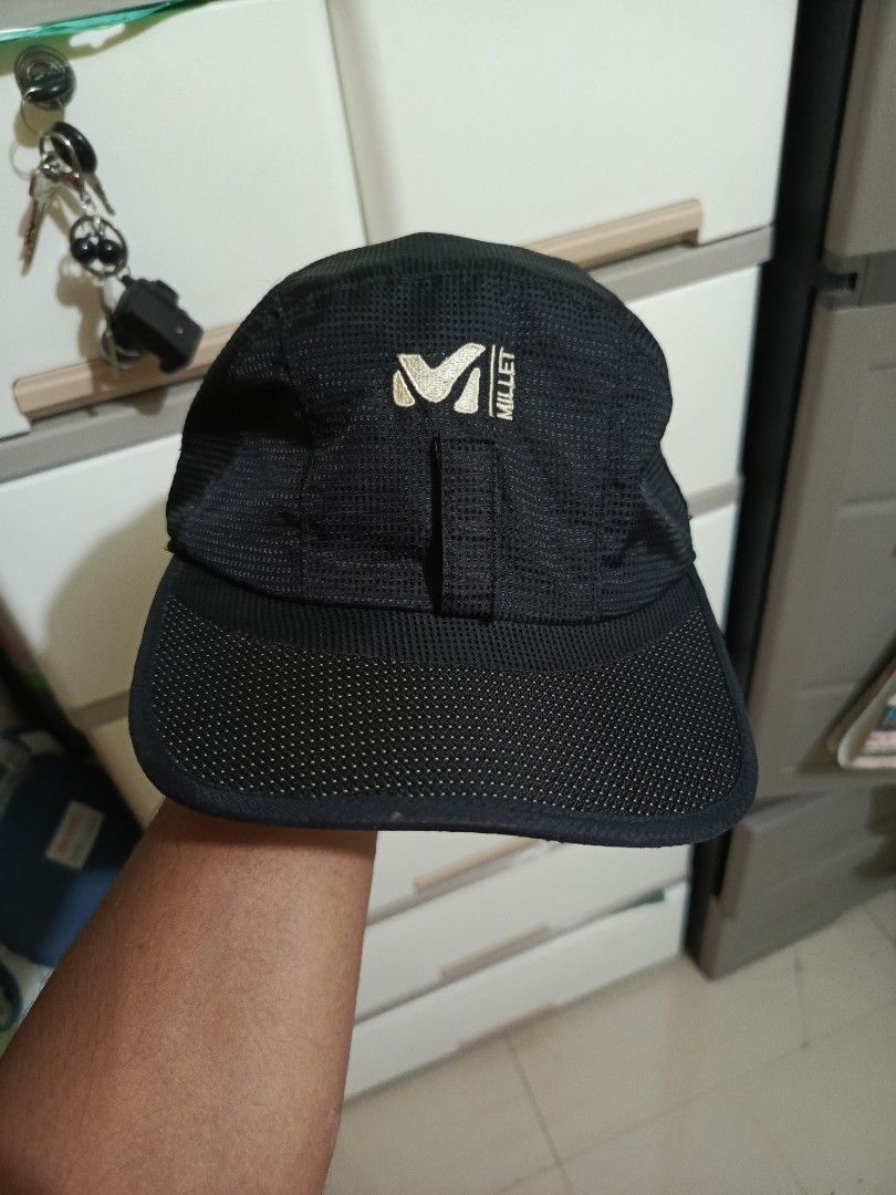 Millet Black Mesh Cap with Ear Flaps (Category: Caps & Hats) located in Irosin. Submitted by whanchore55263 (Listing ID 1465493705, Image 2). Description: - Brand: Millet - Color: Black with gold embroidered logo - Material: Breathable all-over mesh fabric - Features: Flip-down ear flaps for cold/windy weather protection - Closure: Adjustable back strap with velcro - Ideal for: Outdoor running, hiking, sports, and casual wear.