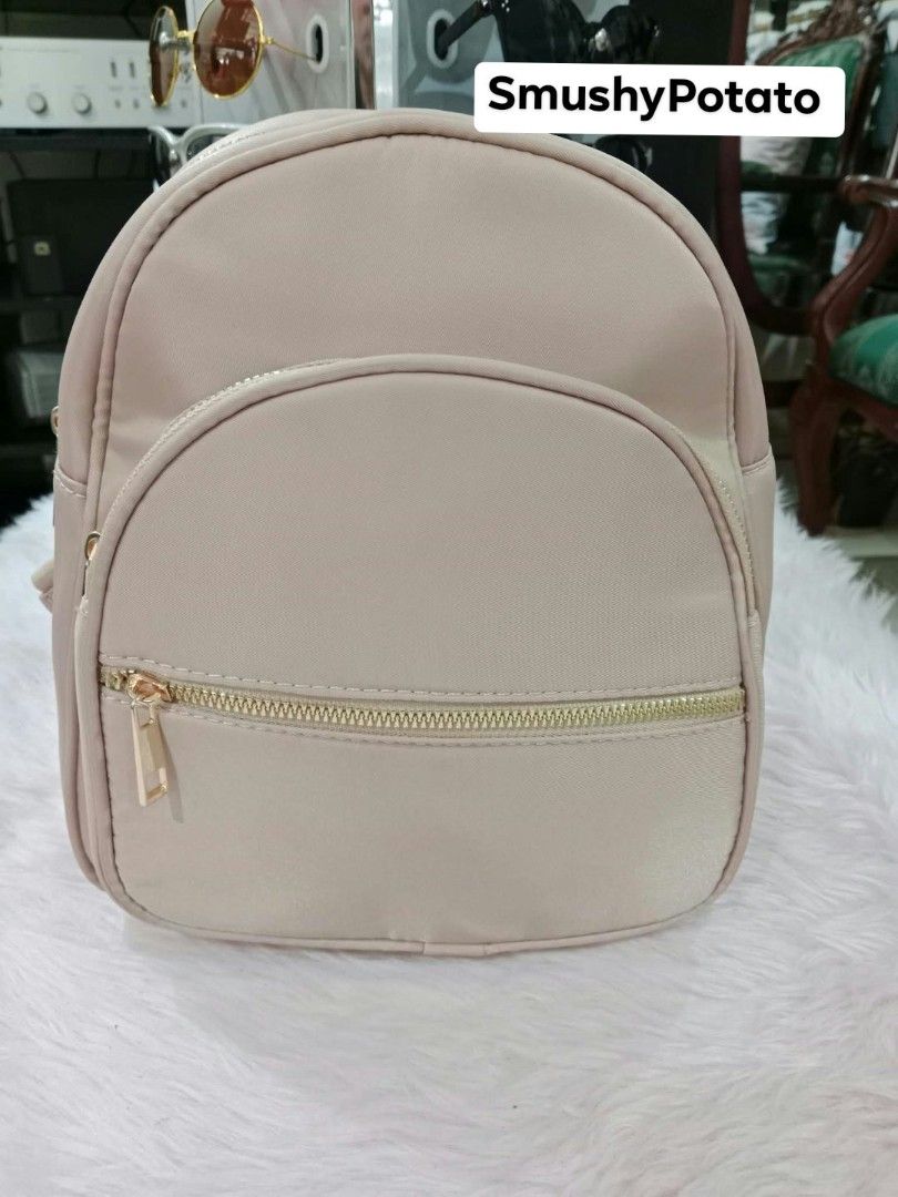 mini backpacks featuring a solid beige design and a multicolor love/heart patterned design, (Category: Backpacks) located in Antipolo. Submitted by smushypotatoo (Listing ID 1465529031, Image 3). Description: .