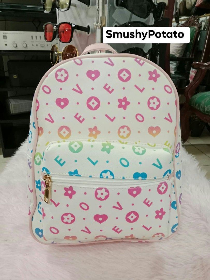 mini backpacks featuring a solid beige design and a multicolor love/heart patterned design, (Category: Backpacks) located in Antipolo. Submitted by smushypotatoo (Listing ID 1465529031, Image 2). Description: .