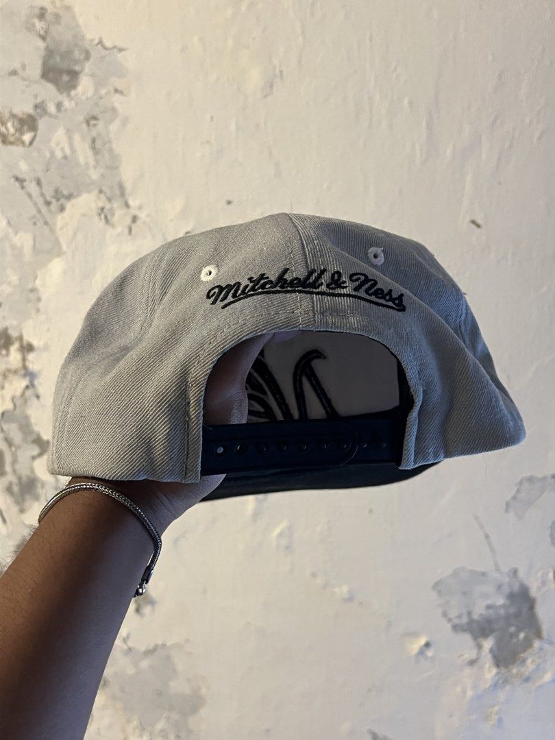Mitchell & Ness Brooklyn Nets Snapback Hat (Category: Caps & Hats) located in Manila. Submitted by maccabeyo (Listing ID 1465412329, Image 2). Description: - Brand: Mitchell & Ness (Official NBA Merchandise) - Team: Brooklyn Nets - Color: Grey crown with black brim - Details: Embroidered team graphics on front and side, with signature embroidery above closure - Closure: Adjustable black snapback - Condition: Brand new / Excellent.
