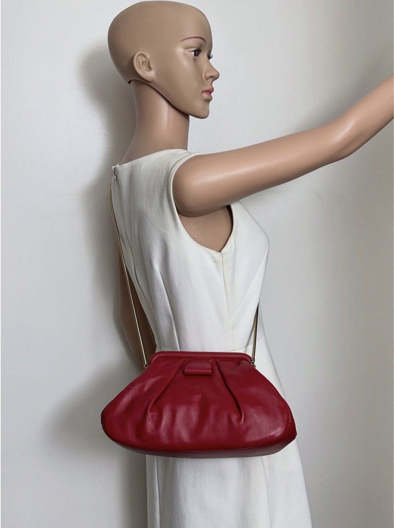 Miu Miu Red Sling Bag (Category: Luxury Bags & Wallets) located in Caloocan City. Submitted by lynchua4 (Listing ID 1465454296, Image 2). Description: Miu Miu pleated nappa soft frame clutch Unique rare bag Inclusion: Dust bag and card.