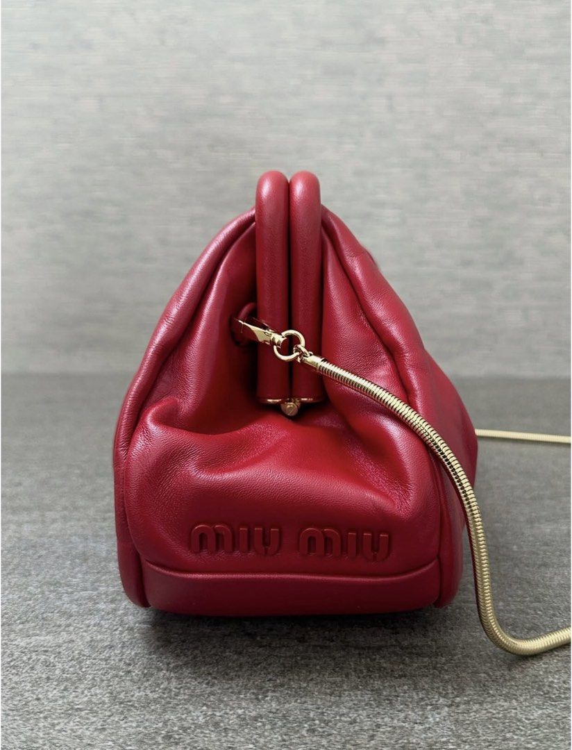 Miu Miu Red Sling Bag (Category: Luxury Bags & Wallets) located in Caloocan City. Submitted by lynchua4 (Listing ID 1465454296, Image 1). Description: Miu Miu pleated nappa soft frame clutch Unique rare bag Inclusion: Dust bag and card.
