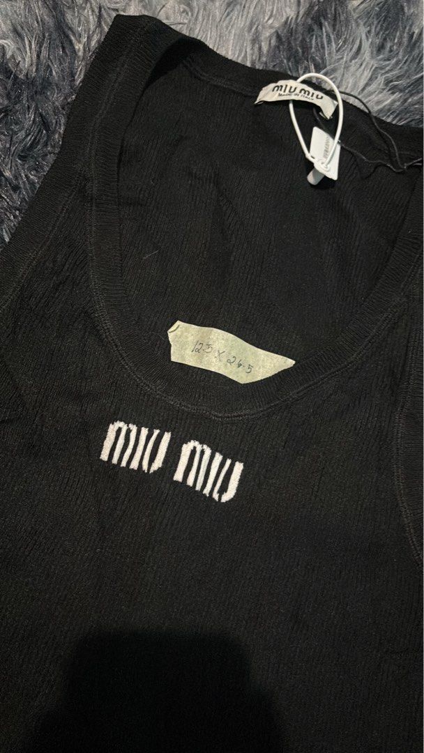 MIUMIU TOPS (Category: Sleeveless) located in Lubao. Submitted by aizgoodthrift (Listing ID 1465494171, Image 2). Description: Miumiu tops no issue good condition Dm me📩.