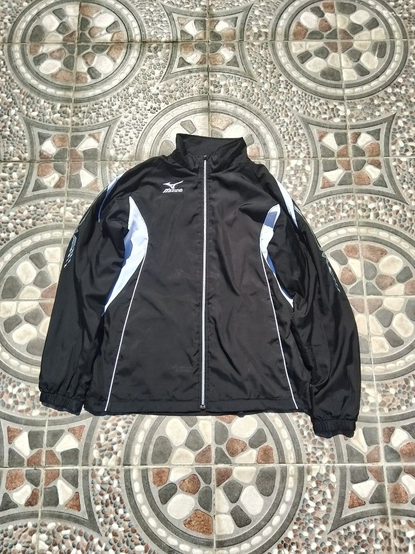 Mizuno Black and White Track Jacket (Category: Coats, Jackets and Outerwear) located in Cabuyao City. Submitted by kyokiiiiiii (Listing ID 1465430018, Image 1). Description: - Brand: Mizuno - Color: Black with white and light blue side panels - Design: Full zip front, high collar, elastic cuffs and hem, Mizuno branding on right chest - Style: Sporty retro look - Best for: Running, workouts, or casual everyday wear - Condition: Excellent.