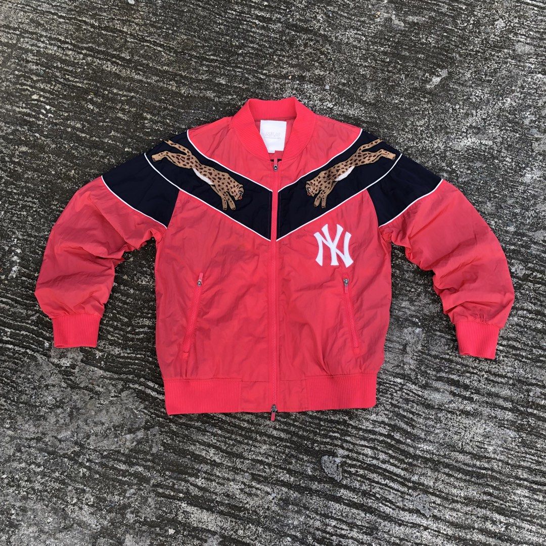 MLB New York Yankees Cheetah Bomber Jacket (Category: Coats, Jackets and Outerwear) located in Manila. Submitted by kelll08 (Listing ID 1465539231, Image 3). Description: - Authentic MLB New York Yankees jacket in red and dark blue - Eye-catching cheetah embroidery across the chest panel - Classic white Yankees logo on the lower front - Comfortable ribbed collar, cuffs, and hem - Secure front zip closure with zippered side pockets - Size: L (100)