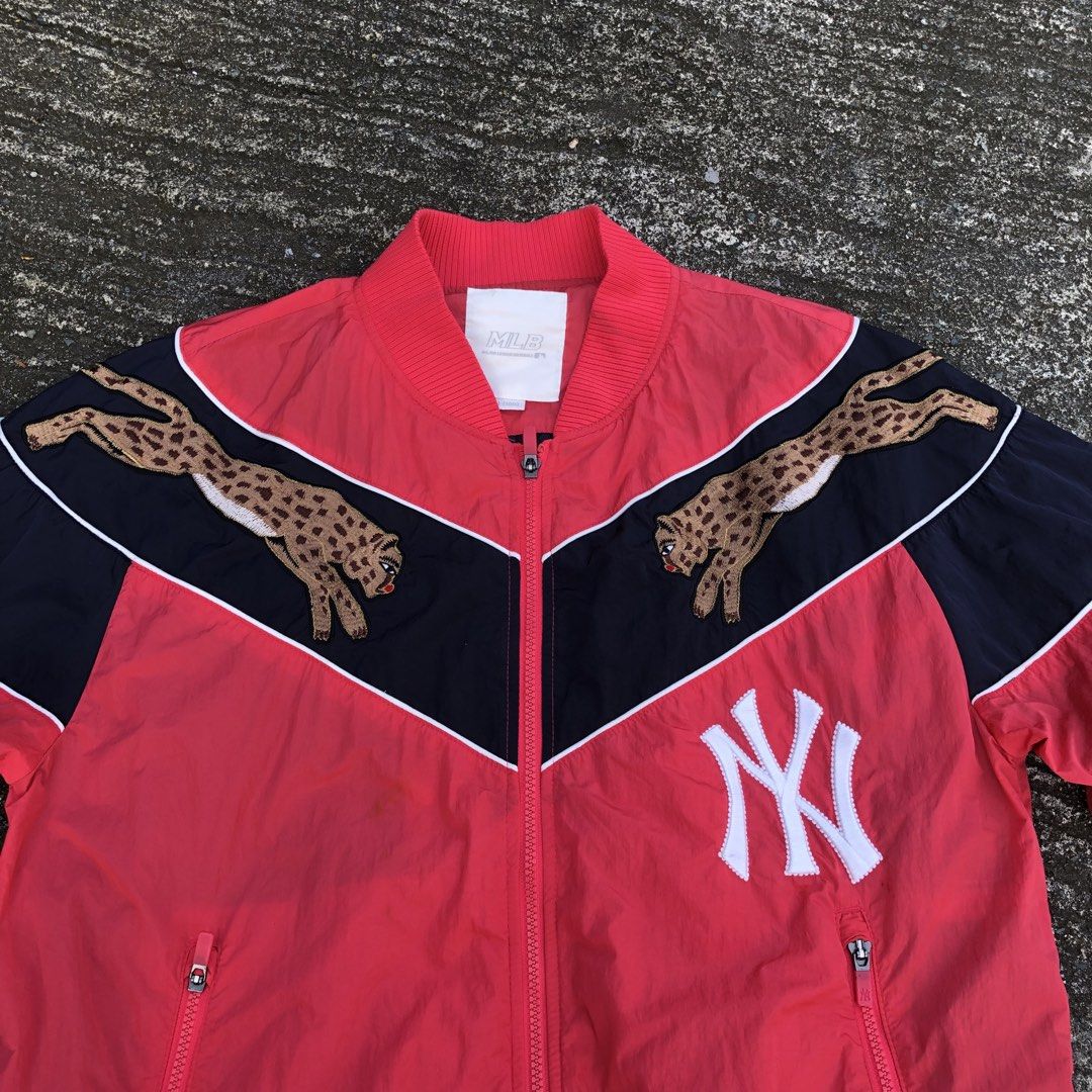 MLB New York Yankees Cheetah Bomber Jacket (Category: Coats, Jackets and Outerwear) located in Manila. Submitted by kelll08 (Listing ID 1465539231, Image 2). Description: - Authentic MLB New York Yankees jacket in red and dark blue - Eye-catching cheetah embroidery across the chest panel - Classic white Yankees logo on the lower front - Comfortable ribbed collar, cuffs, and hem - Secure front zip closure with zippered side pockets - Size: L (100)