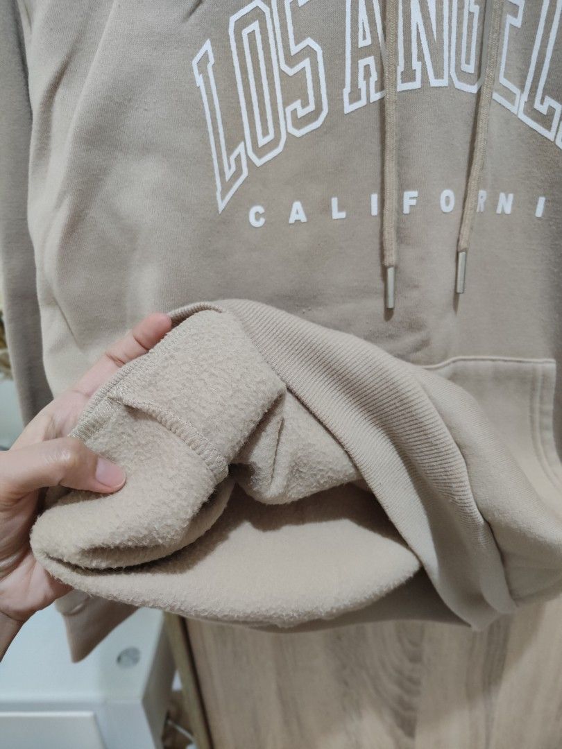 Mocha brown oversized hoodie (Category: Coats, Jackets and Outerwear) located in Cavite. Submitted by itstrish23 (Listing ID 1465415191, Image 3). Description: rare 🤎 light brown in color unisex oversized small - semi large frame soft fabric (non-itchy) HQ ✨ seller from cavite.