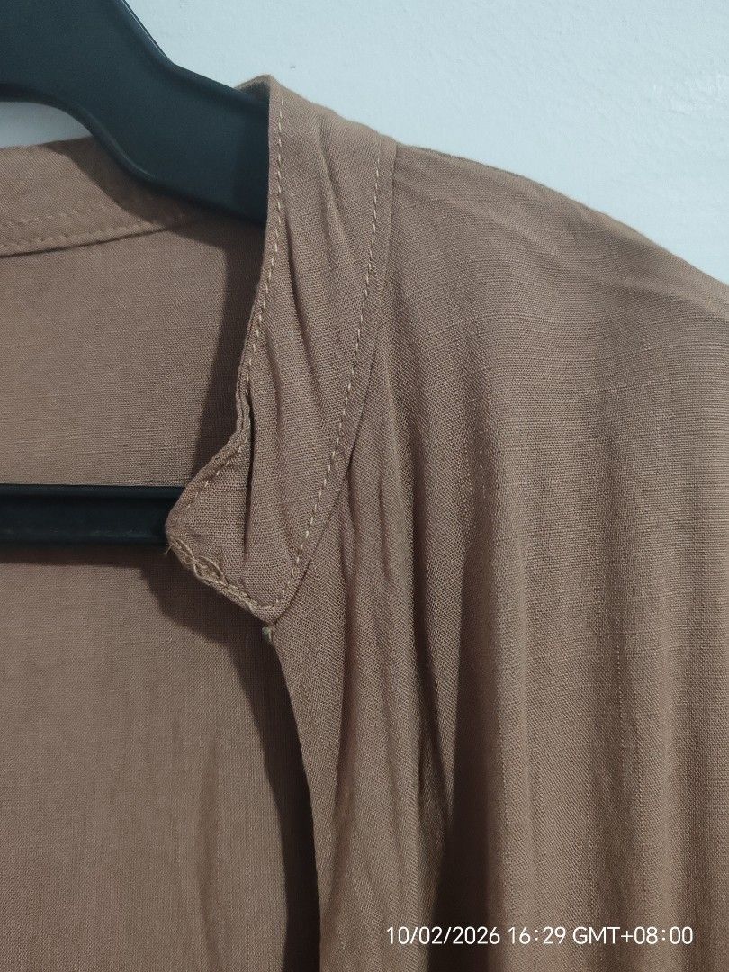 Mocha Oversized Button-Down Top | Loose Fit (Category: Blouses) located in Antipolo. Submitted by purpleclover11 (Listing ID 1465449609, Image 3). Description: Mocha oversized button-down top with a relaxed, flowy fit. Features a simple collarless/V-neck design, short sleeves, and button-down front. Lightweight and easy to pair with jeans, shorts, or trousers. • Brand: Unbranded • Color: Mocha / Brown • Fit: Oversized / Loose fit • Washed once • 