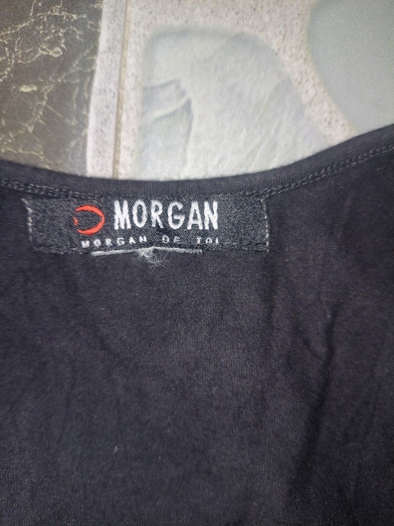Morgan de Toi Black Tank Top with Silver Sequins (Category: Sleeveless) located in Narvacan. Submitted by picky_looter (Listing ID 1465525984, Image 2). Description: - Brand/Style: Authentic Morgan de Toi black tank top with a standard fit - Design: Eye-catching large silver sequin graphic with sparkling details - Comfort: Made from a soft, breathable cotton blend fabric - Details: Classic scoop neckline with supportive thick straps - Versatility