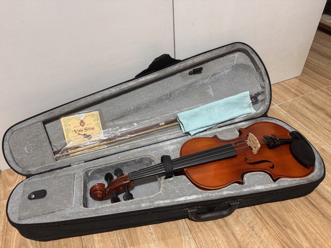 Mozart 4/4 Violin with Case, Bow, Extra Strings & Accessories (Category: Music Accessories) located in Malabon City. Submitted by queen_kendra098 (Listing ID 1465499874, Image 1). Description: Pre-loved 4/4 full-size violin in good working condition. Recently cleaned and restrung. Selling because I already have another violin that I currently use. Includes violin, padded case, bow, rosin, extra set of King Lion strings, spare bridge, and spare pe