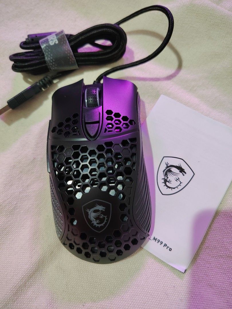 MSI M99 Pro Gaming Mouse (Category: Mouse & Mousepads) located in Mandaluyong City. Submitted by declutter_kween (Listing ID 1465525999, Image 2). Description: - Model: MSI M99 Pro Gaming Mouse (Black) - Lightweight honeycomb shell design - Durable braided USB cable with attached neatness strap - Includes original box and instruction manual - Fully tested 100% working - Never used, comes with own box.