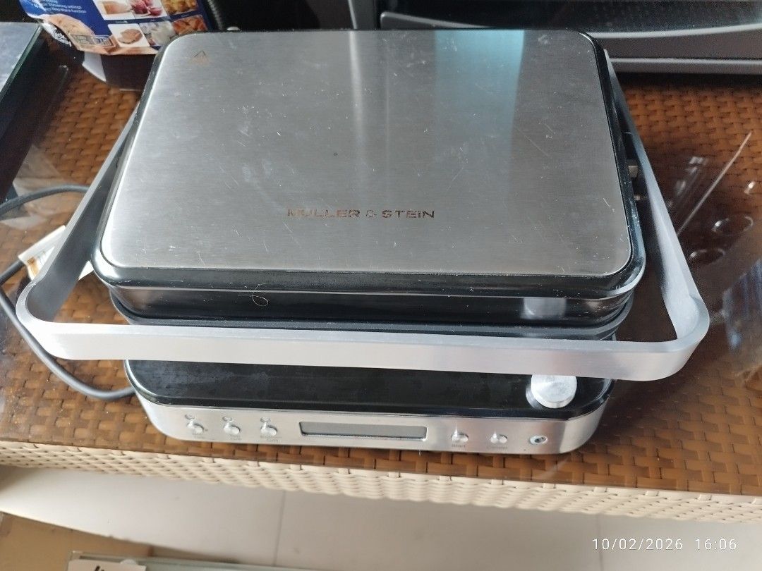 Muller & Stein Electric Grill Press (Category: BBQ, Grills & Hotpots) located in Cebu City. Submitted by jlorana11395954 (Listing ID 1465454105, Image 1). Description: - Condition: Used Once . Like new. Clean and fully functional - Design: Brushed metal finish with a silver handle and digital display panel - Controls: Separate buttons for top grill, bottom grill, and dual grill modes - Plates: Ribbed non-stick cooking plates that open completely 