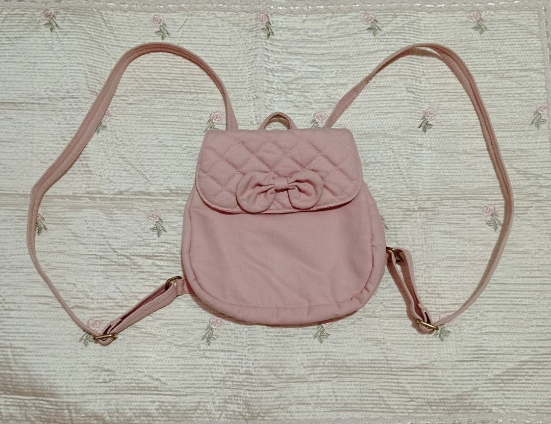 Naraya Pink Denim Mini Backpack (Category: Backpacks) located in Pililla. Submitted by patriciarchives (Listing ID 1465454270, Image 1). Description: - pink denim texture - working zipper - no issues - rfs: very cute but minimal lang din malalagay mo dito T T.