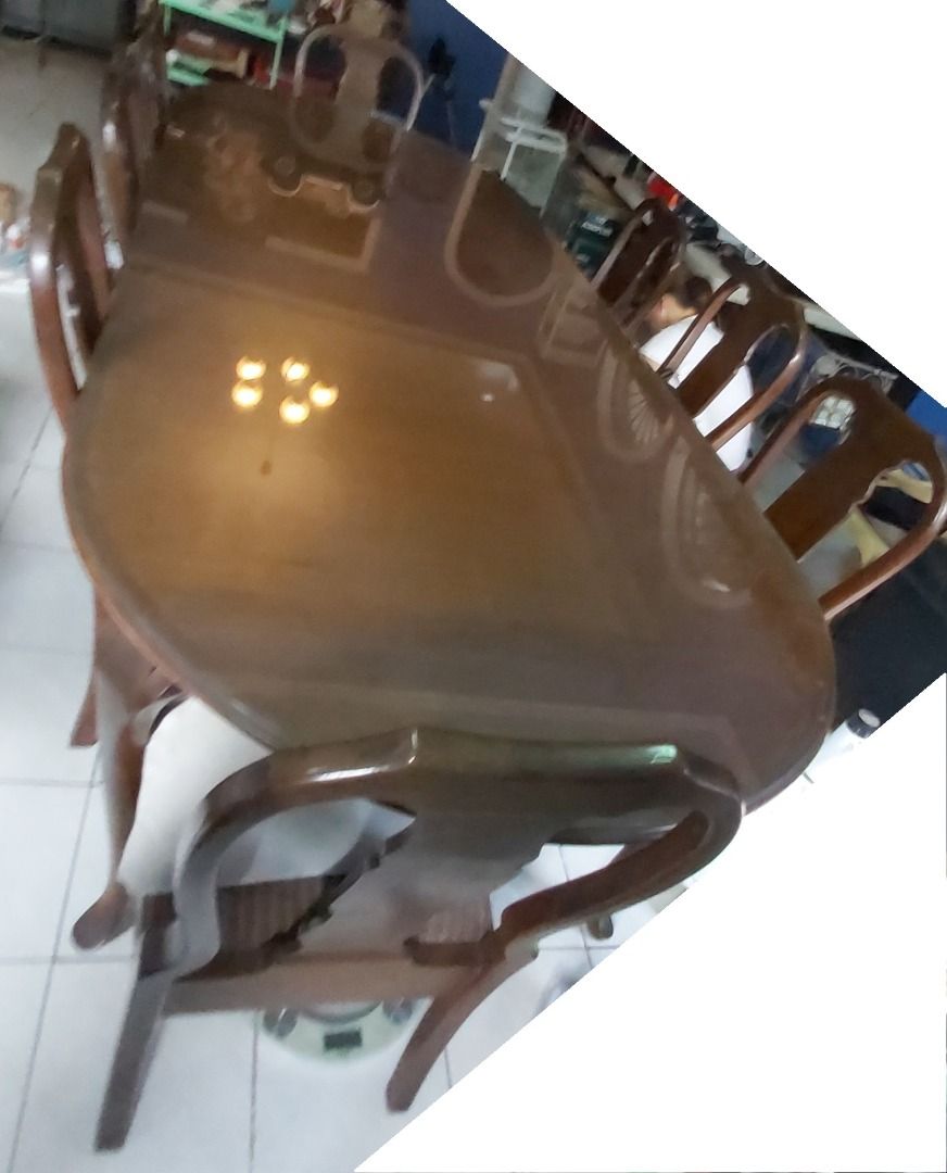 Narra 10-seater long dining table (Category: Everything Else Others) located in Quezon City. Submitted by low-ballers_will_be_blocked (Listing ID 1465226063, Image 2). Description: mint solid heavy Narra wood with glass top and original mint upholstery. 2 host / head chairs. since 1978.