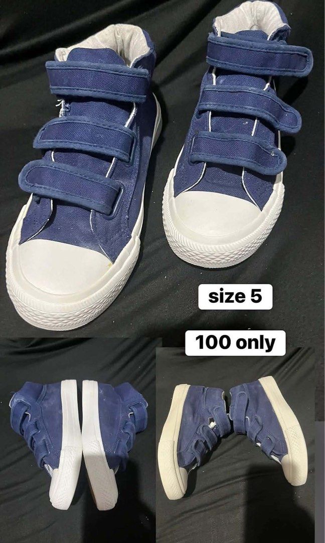 Navy Blue High-Top Sneakers Size 5 (Category: Sneakers) located in Manila. Submitted by kiyanna.preloved (Listing ID 1465508007, Image 1). Description: - Color: Classic navy blue - Style: High-top canvas sneakers with 3 easy hook-and-loop velcro straps - Size: 5 (stamped on graphic) - Design: White rubber toe caps and textured white outsoles with clean interior lining - Condition/Use: Good budget-friendly pair for casual everyday wear.