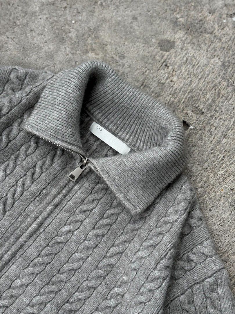 Neo Grey Cable Knit Full Zip Sweater Collared Jacket (Category: Coats, Jackets and Outerwear) located in Lucena. Submitted by whats-good (Listing ID 1465473096, Image 2). Description: - Brand/Model: Neo grey cable knit jacket - Closure & Neck: Full zip front with a high collar - Material & Texture: Heavyweight cotton/wool blend with all-over textured knit pattern - Details: Thick ribbed hem and cuffs - Condition: Clean, no obvious flaws - Best Fo