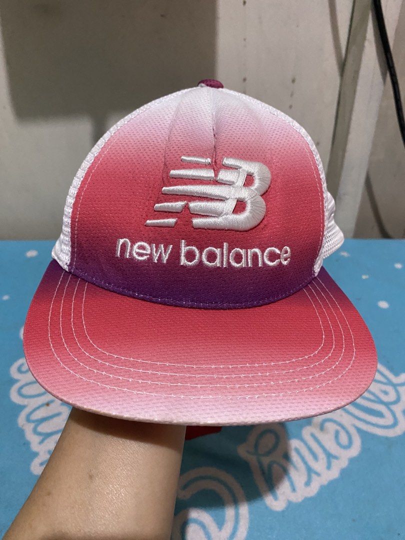 New Balance Gradient Trucker Cap Pink White (Category: Babies & Kids Fashion) located in Manila. Submitted by resi.diaz (Listing ID 1465435000, Image 3). Description: - Size Small. 51 cm - Authentic New Balance trucker cap - Eye-catching pink and white gradient ombre colorway - Breathable mesh back panels for all-day comfort and coolness - Classic embroidered white logo on the front crown - Subtle red logo text embroidery above the back opening -
