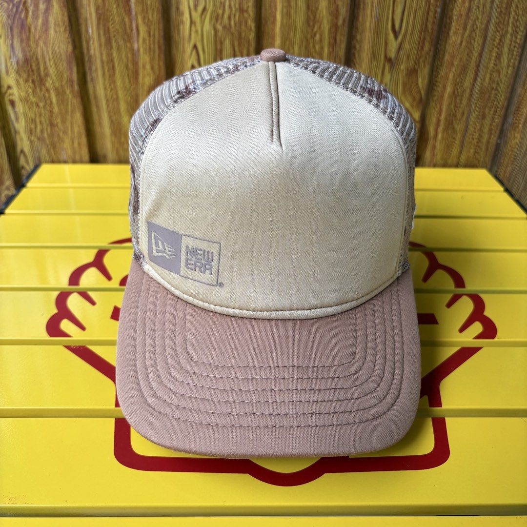 New Era Trucker Cap Khaki Brown (Category: Caps & Hats) located in Dapitan. Submitted by payt3es_thrift. (Listing ID 1465392472, Image 1). Description: New Era trucker hat in khaki and brown tones. Mesh back panel for breathability and snapback closure at the rear for an adjustable fit. Solid front panels with small New Era logo tag on the lower left. Curved brim in solid brown. Clean interior lining with brand tape along the seams..