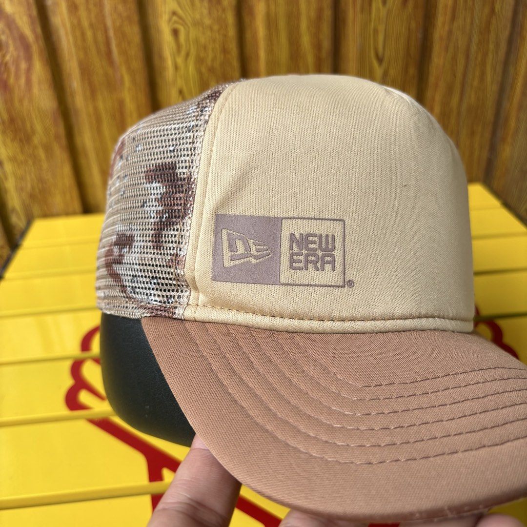 New Era Trucker Cap Khaki Brown (Category: Caps & Hats) located in Dapitan. Submitted by payt3es_thrift. (Listing ID 1465392472, Image 2). Description: New Era trucker hat in khaki and brown tones. Mesh back panel for breathability and snapback closure at the rear for an adjustable fit. Solid front panels with small New Era logo tag on the lower left. Curved brim in solid brown. Clean interior lining with brand tape along the seams..