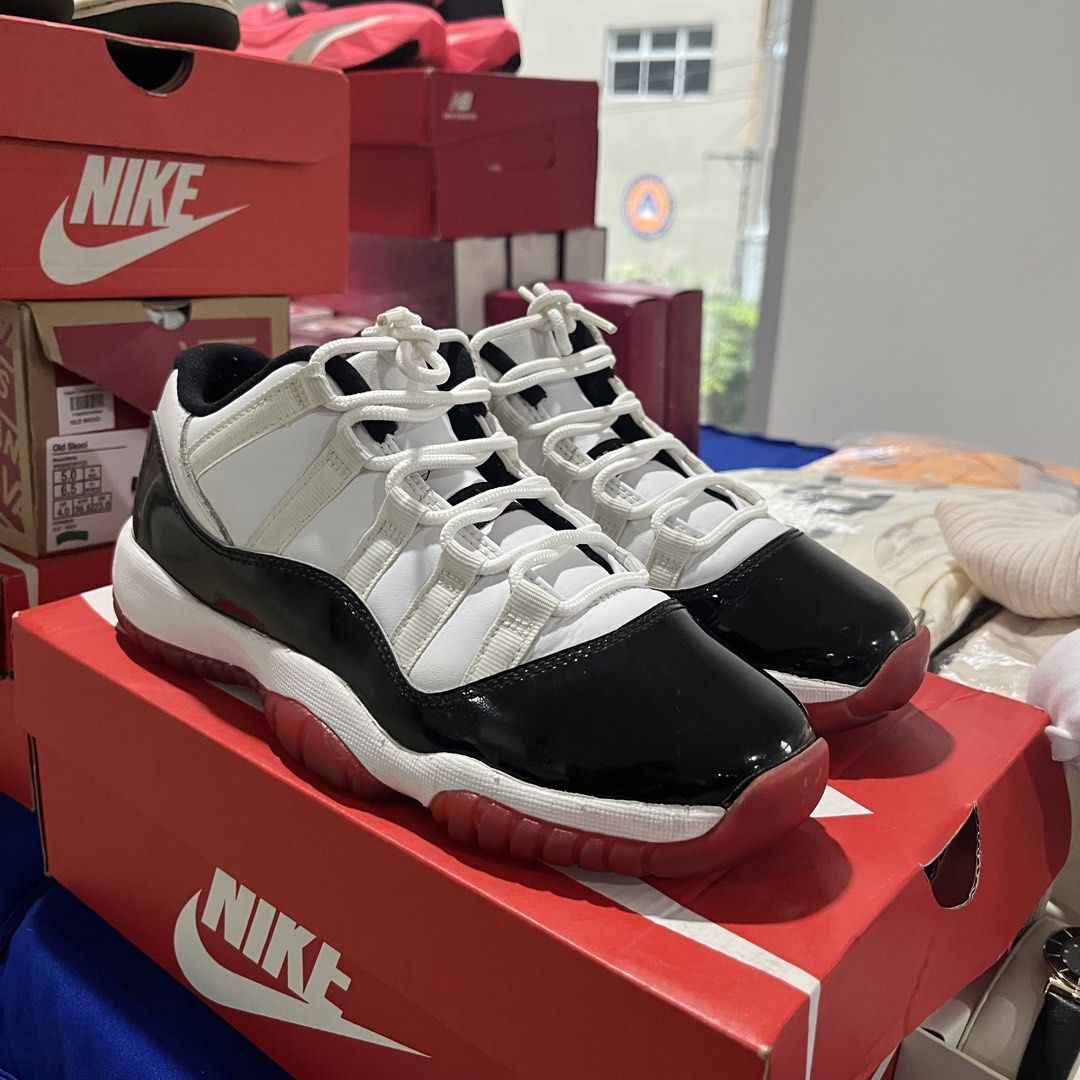 Nike Air Jordan 11 Retro Low (Category: Sneakers) located in Quezon City. Submitted by biannerellamas (Listing ID 1465552446, Image 2). Description: NEEDS REGLUE IN FRONT - Colorway: White and black patent leather with crisp white laces - Outsole: Eye-catching red translucent rubber - Design: Classic Jordan silhouette with clean contrast panels - Perfect for daily wear or collection.