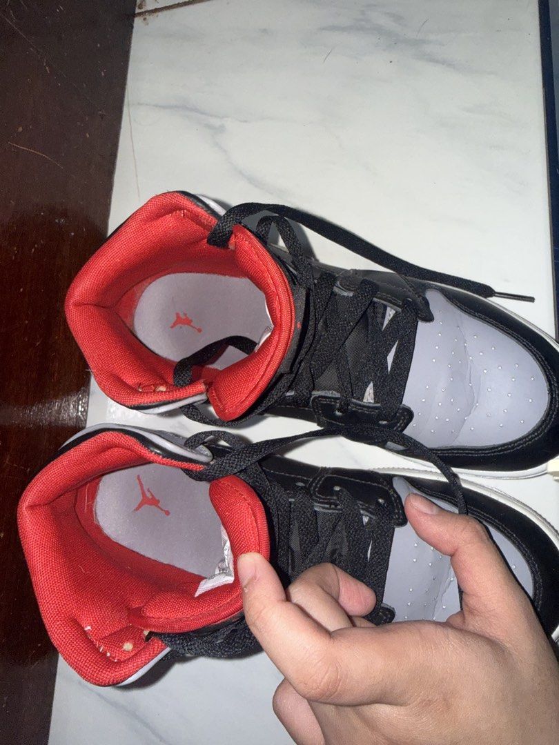 Nike Air Jordan 1 Mid Grey Black Red (Category: Sneakers) located in Quezon City. Submitted by tinemacasa99211 (Listing ID 1465541232, Image 2). Description: - Model: Jordan 1 Mid - Colourway: Grey, black, and red with red inner lining - Size: Youth 6Y / EUR 38.5 / US 7.5 WOMEN - Condition: Ready to wear with visible toe box creasing from normal use - Soles: Standard grip tread intact.