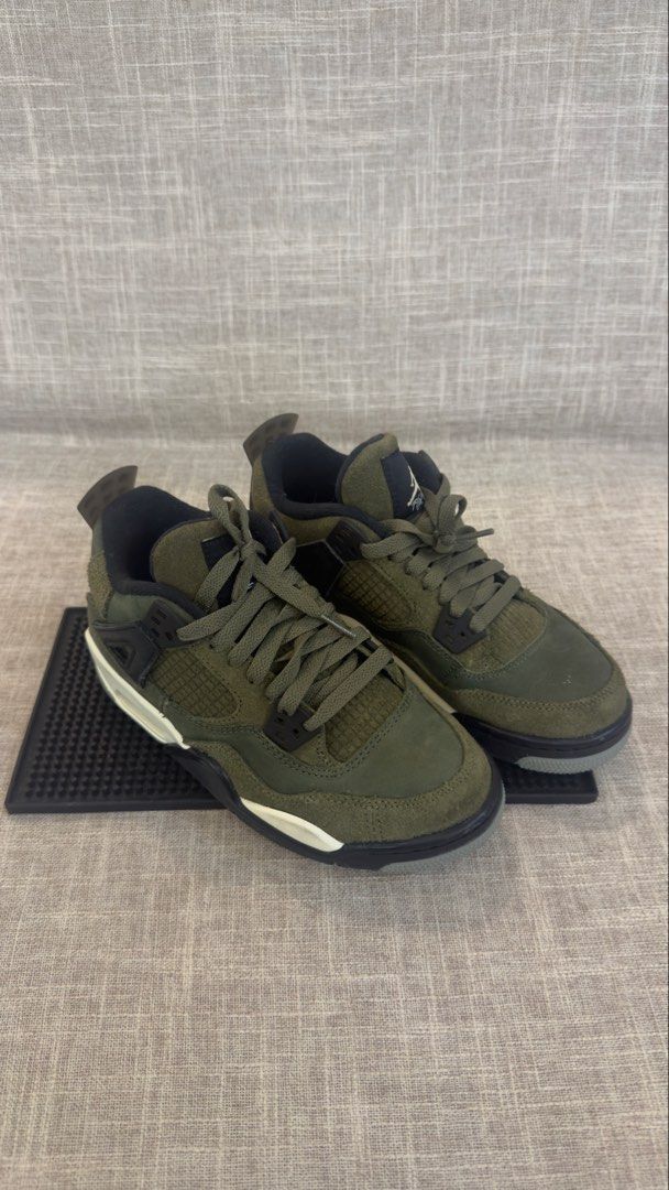 Nike Air Jordan 4 Retro Craft Olive (Category: Sneakers) located in Makati City. Submitted by bucherrybee (Listing ID 1465471341, Image 2). Description: - Model: Nike Air Jordan 4 Retro - US 4Y UK 3.5 EURO 36 CM 23 - Colorway: Medium Olive / Black / Pale Vanilla - Material: Premium suede and textile upper with classic grid mesh - Details: Jumpman logo on tongue and heel, visible Air cushioning - Condition: Clean pair, ready to wear - Meet-ups or 