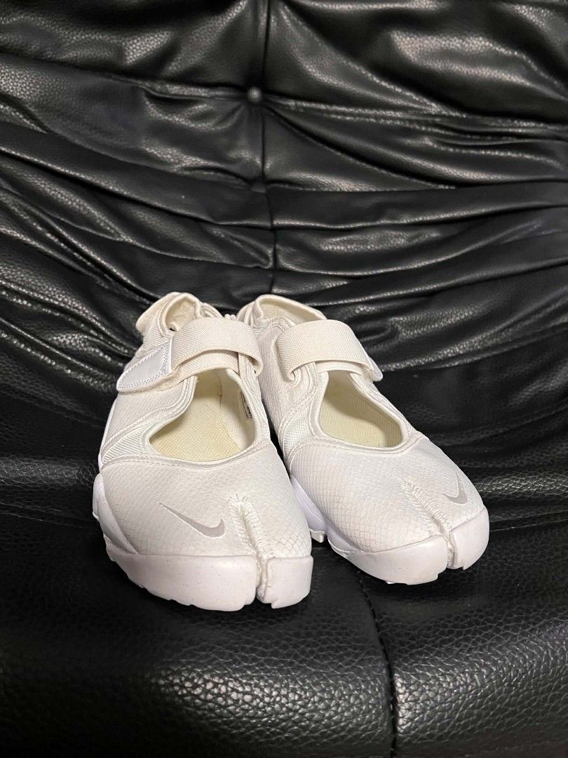 Nike Air Rift Br White Split Toe Sneakers Size US 7 (Category: Sneakers) located in Quezon City. Submitted by idk.uno (Listing ID 1465529805, Image 2). Description: - Brand/Model: Nike Air Rift Breathe - Colorway: Triple White - Size: US [Insert Size] - Condition: Excellent, worn lightly with minimal signs of wear - Features: Iconic split-toe design, adjustable hook-and-loop straps at midfoot and heel, breathable mesh upper, and chunky foam midso