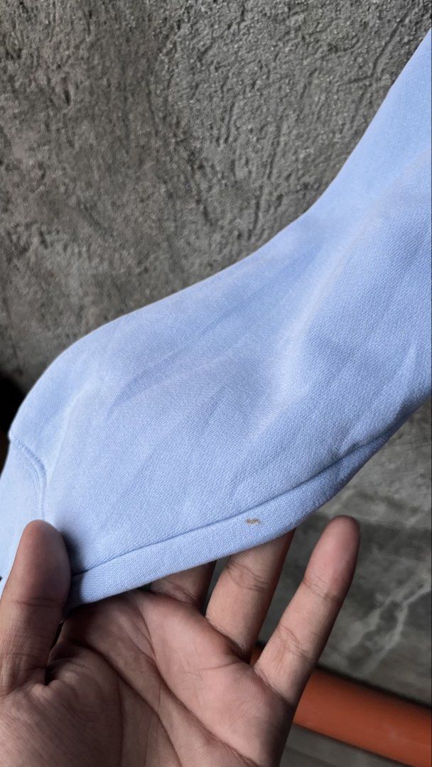 Nike Baby Blue Sweatshirt Size M (Category: Coats, Jackets and Outerwear) located in Cabuyao City. Submitted by bulandos (Listing ID 1465474727, Image 3). Description: - Brand: Nike - Item: Crewneck Sweatshirt - Color: Baby Blue - Size: Medium - Material: Thick, warm cotton-polyester blend with fleece lining - Details: Small embroidered swoosh on the left chest - Flaws: Several noticeable brown stains near the bottom hem and a minor spot on the s
