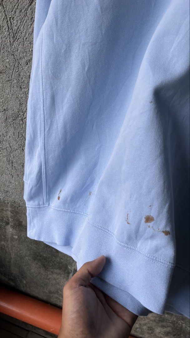 Nike Baby Blue Sweatshirt Size M (Category: Coats, Jackets and Outerwear) located in Cabuyao City. Submitted by bulandos (Listing ID 1465474727, Image 2). Description: - Brand: Nike - Item: Crewneck Sweatshirt - Color: Baby Blue - Size: Medium - Material: Thick, warm cotton-polyester blend with fleece lining - Details: Small embroidered swoosh on the left chest - Flaws: Several noticeable brown stains near the bottom hem and a minor spot on the s