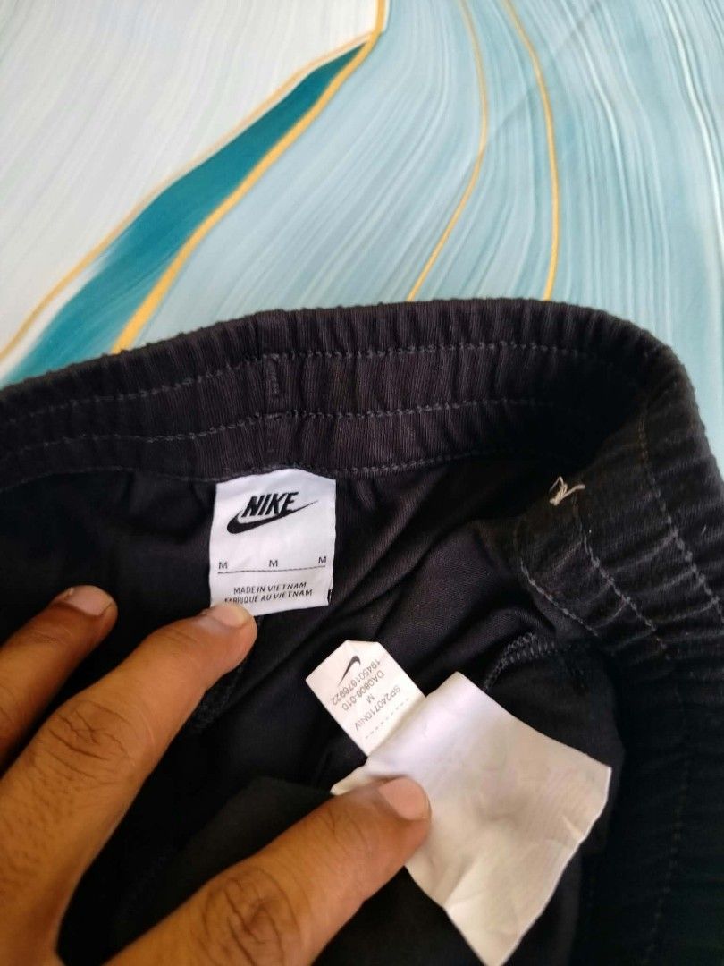 Nike Black Athletic Shorts Size M (Category: Shorts) located in Manila. Submitted by virgiliosa38485 (Listing ID 1465499697, Image 3). Description: - Brand: Nike - Color: Classic Black - Size: Men's Medium -Waist 26-30 -Length 15 - Origin: Made in Vietnam - Style Code: DA0806-010 - Features: Elastic waistband, adjustable drawstring, and white embroidered Nike logo near the hem - Condition: Comfort-focused sportswear staple, perfect for workouts o