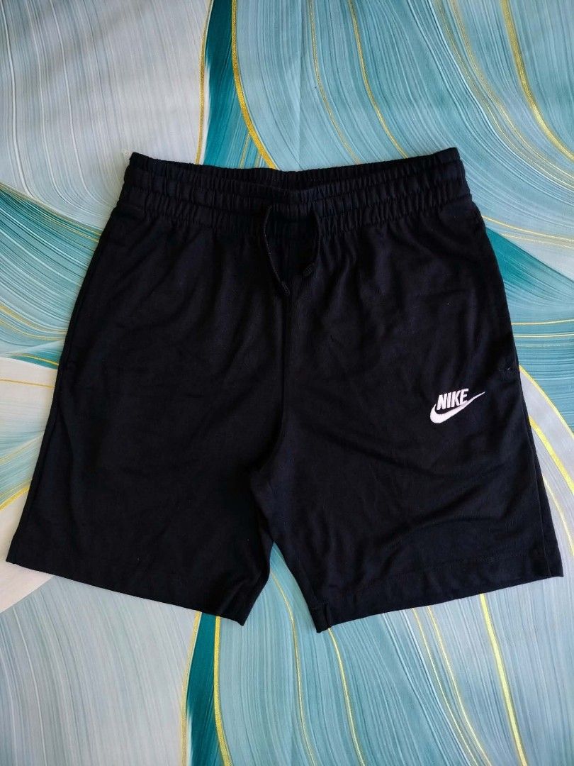 Nike Black Athletic Shorts Size M (Category: Shorts) located in Manila. Submitted by virgiliosa38485 (Listing ID 1465499697, Image 1). Description: - Brand: Nike - Color: Classic Black - Size: Men's Medium -Waist 26-30 -Length 15 - Origin: Made in Vietnam - Style Code: DA0806-010 - Features: Elastic waistband, adjustable drawstring, and white embroidered Nike logo near the hem - Condition: Comfort-focused sportswear staple, perfect for workouts o