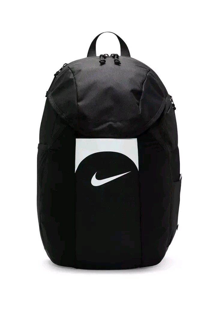 Nike Black Backpack with White Swoosh Logo (Category: Backpacks) located in Marikina City. Submitted by geloboixxx (Listing ID 1465465110, Image 1). Description: - Color: Sleek black with a striking white curved logo panel on the front - Storage: Spacious main compartment with top flap closure and a convenient side zipper pocket - Comfort & Portability: Sturdy, adjustable shoulder straps with a subtle Nike swoosh and a handy top handle - Material