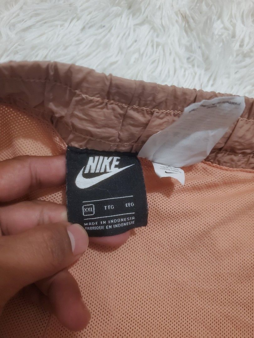 Nike Brown Shorts Size XXL (Category: Shorts) located in Manila. Submitted by royalrabbit.7b2a11 (Listing ID 1465516238, Image 3). Description: - Brand: Nike - Color: Brown with white logo near the hem - Size: XXL - Material: Orange mesh interior lining - Features: Elastic waistband with white drawstring - Origin: Made in Indonesia - Style: Casual daily wear.