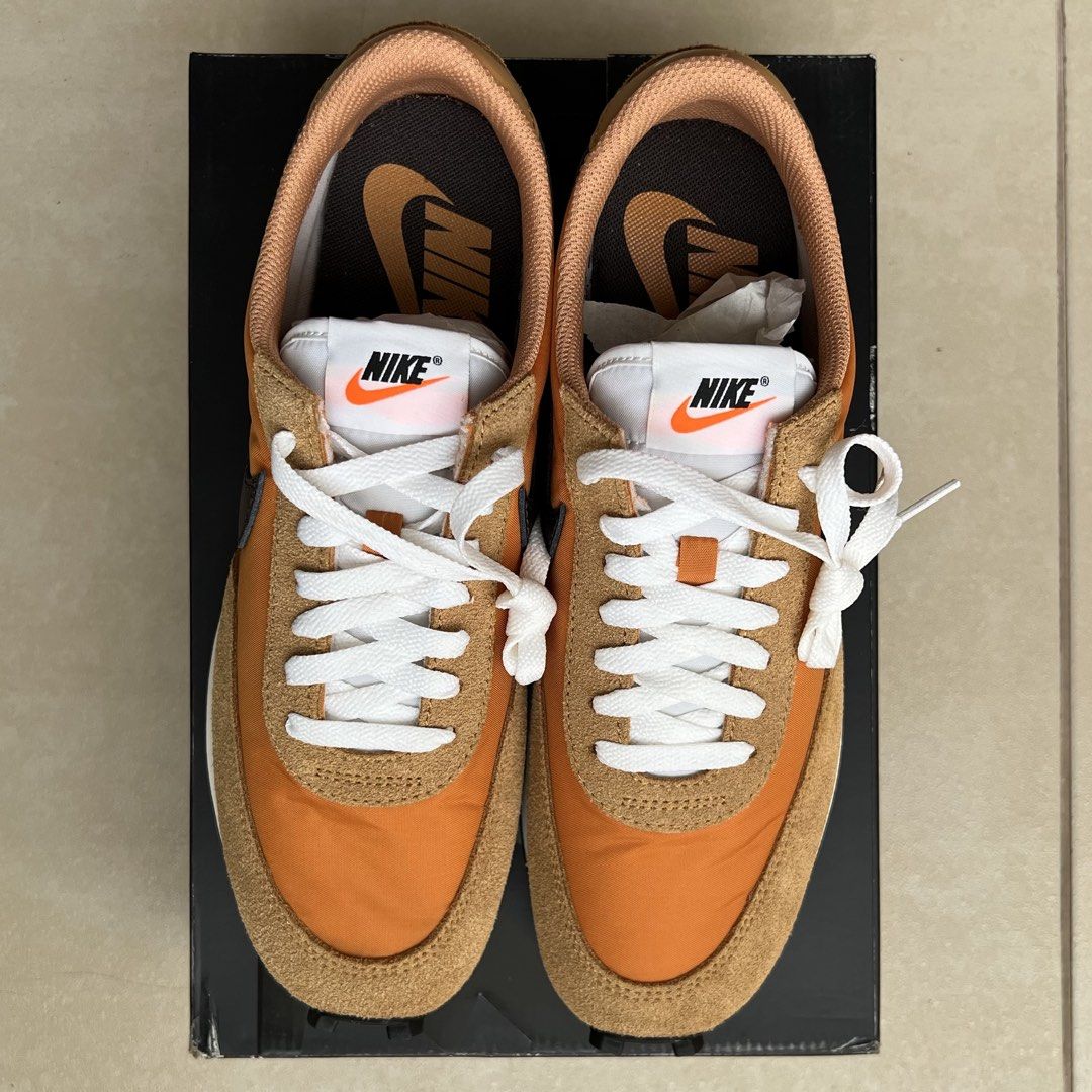 Nike Daybreak SP Orange/Brown (Category: Sneakers) located in Taguig. Submitted by groovez_jp (Listing ID 1465421872, Image 3). Description: - Model: Nike Daybreak Retro Runners - Colorway: Orange and Brown - Materials: Premium suede and nylon upper with classic waffle sole - Details: Crisp white laces and matching inner lining - Packaging: Includes original black Nike shoebox - Condition: Excellent condition, ready to wear.
