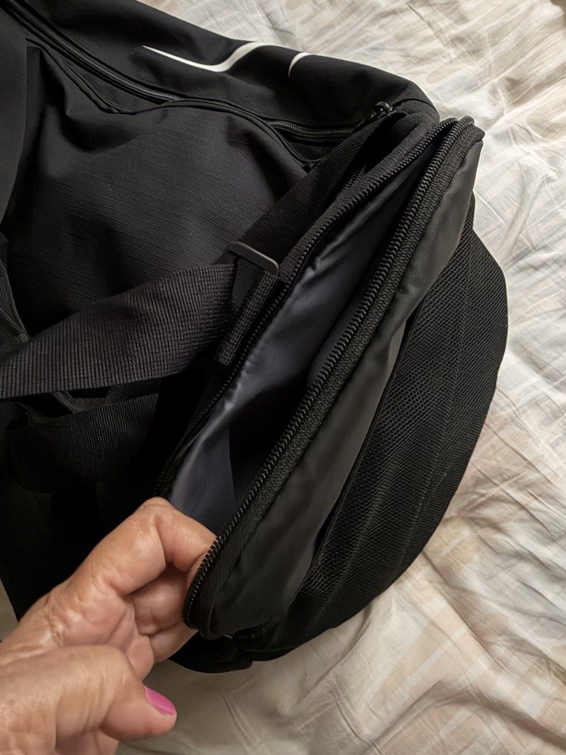 Nike duffle bag (Category: Sling Bags) located in Manila. Submitted by bondea (Listing ID 1465385411, Image 3). Description: Authentic Brand new with tag Bought in Singapore Slightly negotiable Spacious With Sports water bottle container at the sides With 2 side zippered pockets 51 liters.
