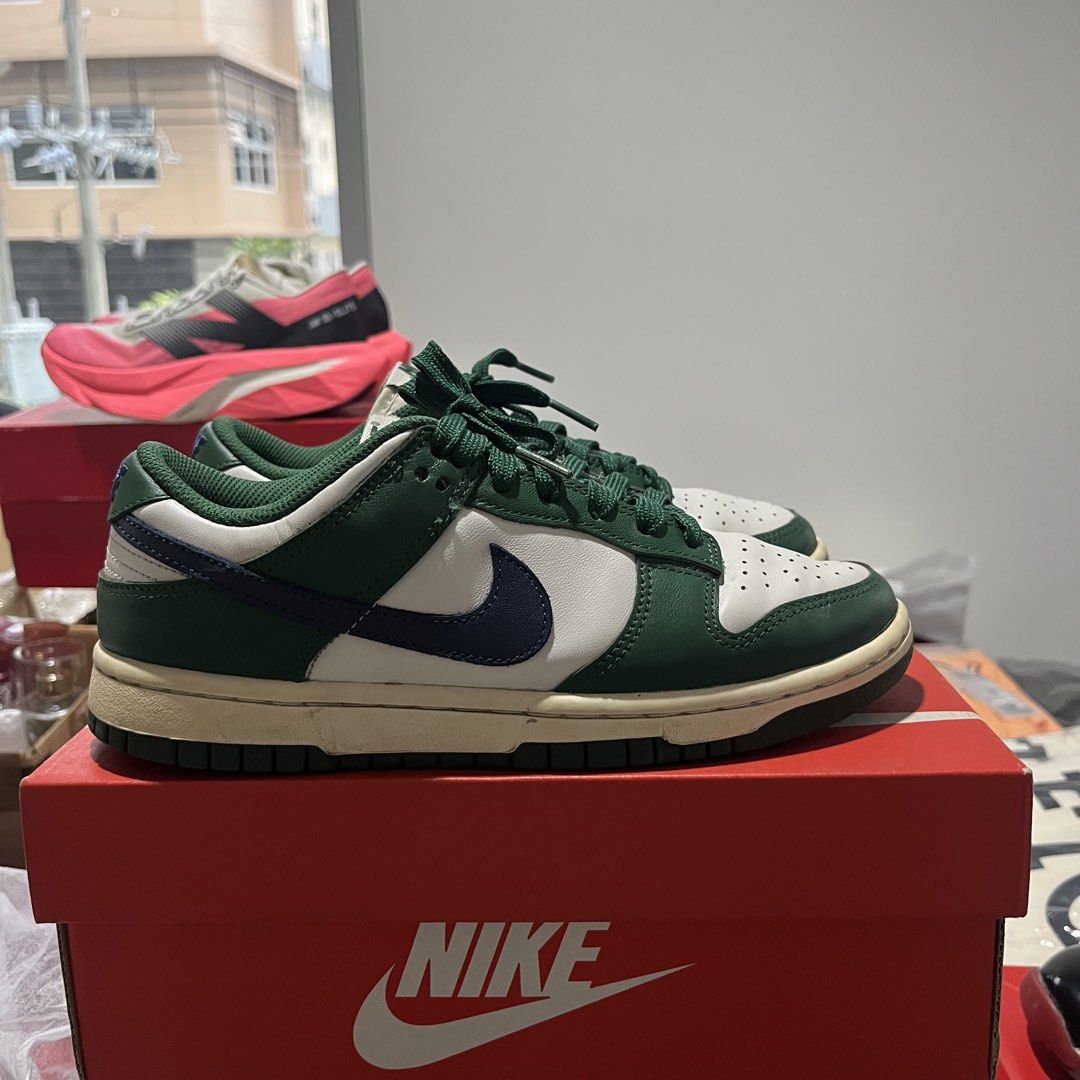Nike Dunk Low Gorge Green (Category: Sneakers) located in Quezon City. Submitted by biannerellamas (Listing ID 1465552169, Image 1). Description: - Model: Nike Dunk Low - Colorway: Crisp white leather base with dark green overlays and dark blue swoosh - Details: Trendy chunky green laces, green mesh tongue with Nike branding, and a vintage cream-colored midsole - Condition: Brand new / Like new (Inquire for exact sizing) - Inclusion: Comes with o