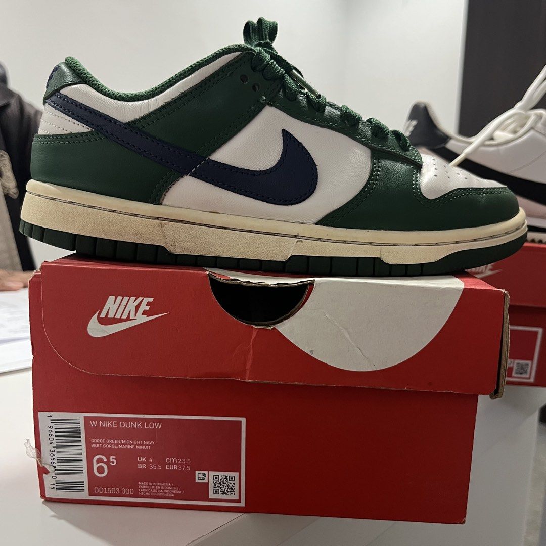 Nike Dunk Low Gorge Green (Category: Sneakers) located in Quezon City. Submitted by biannerellamas (Listing ID 1465552169, Image 3). Description: - Model: Nike Dunk Low - Colorway: Crisp white leather base with dark green overlays and dark blue swoosh - Details: Trendy chunky green laces, green mesh tongue with Nike branding, and a vintage cream-colored midsole - Condition: Brand new / Like new (Inquire for exact sizing) - Inclusion: Comes with o