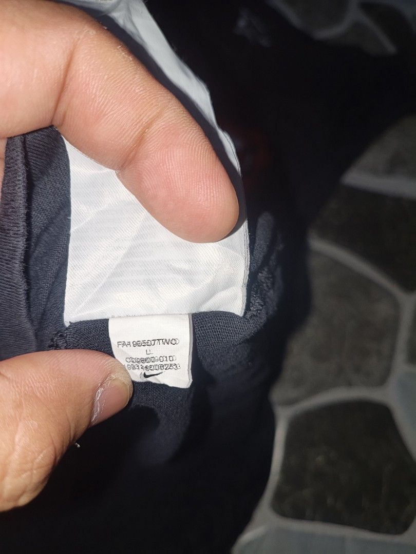 Nike Just Do It Black Tank Top Size L (Category: Activewear) located in Narvacan. Submitted by picky_looter (Listing ID 1465524961, Image 2). Description: Black Nike tank top with large red box graphic on the front reading Just Do It and small Nike logo patch. Size L printed on the inner neck tag and fabric label. Made in Cambodia from cotton material. Standard sleeveless athletic cut with a scoop neckline. Simple everyday sportswear piece..