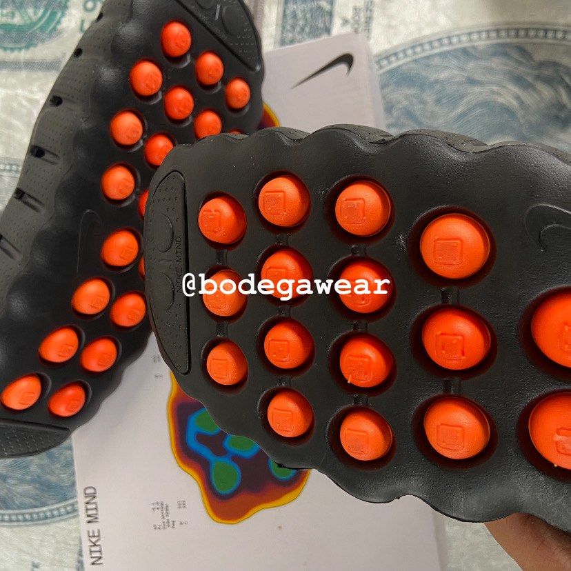 Nike Mind Slides Black Orange (Category: Slippers & Slides) located in Manila. Submitted by bodegawear_mnl (Listing ID 1465409235, Image 3). Description: - Model: Nike Mind Slides - Colorway: Black and Vibrant Orange - Design: Slip-on mule silhouette with a unique podular outsole and silver side Swoosh - Condition: Brand new with original Nike Mind box and tags - Perfect for daily casual wear or adding a pop of color to your fit.