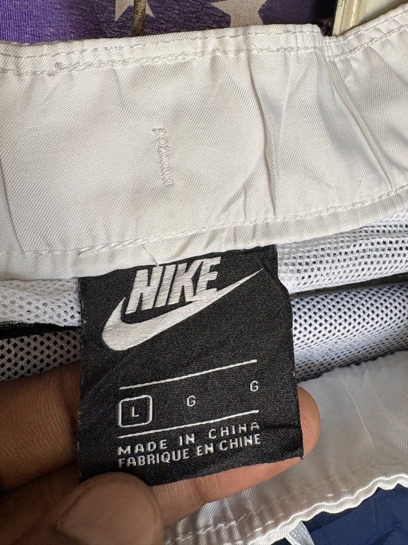Nike Navy Blue Shorts Large (Category: Shorts) located in Tuguegarao City. Submitted by urdailyhabitat (Listing ID 1465424228, Image 2). Description: - Brand: Nike - Color: Navy blue with large white leg logo - Size: Large - Waistband: White elastic for a comfortable fit - Condition: Clean overall - Style Code: CT9485-492 - Origin: Made in China.