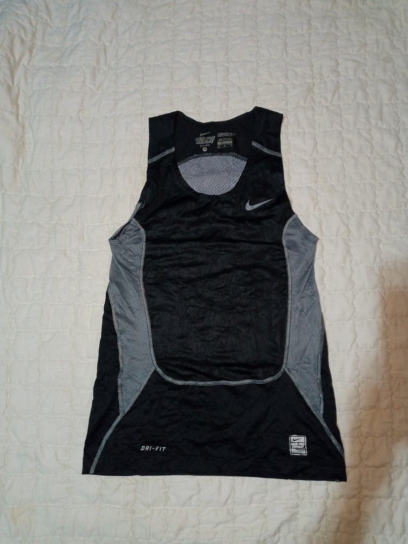 Nike Pro Combat Dri-FIT Compression Tank Top (Category: Activewear) located in Allen. Submitted by milyonaryung_gipit (Listing ID 1465395322, Image 1). Description: - Brand: Nike Pro Combat - Item: Compression tank top - Color: Black and Grey - Size: Medium (M) - Material/Tech: Dri-FIT fabric to keep you cool and dry - Ventilation: Mesh panels on the back and sides for extra breathability - Details: Nike Pro Combat label near the hem - Best for: 