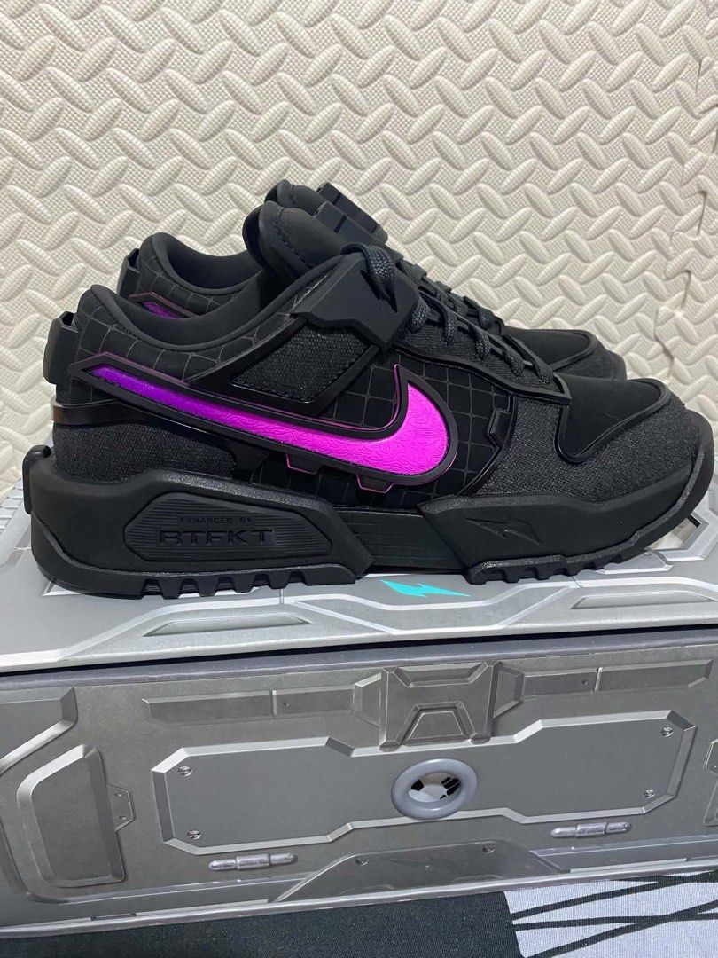 Nike RTFKT Dunk Genesis Black Purple Sneakers (Category: Sneakers) located in San Fernando. Submitted by kickslocker (Listing ID 1465405471, Image 2). Description: - Brand: Nike x RTFKT - Colorway: Black and purple with vibrant purple Swoosh branding - Design: Chunky soles, futuristic details, and sturdy build - Packaging: Includes the original custom silver box - Condition: Excellent addition to any collection.