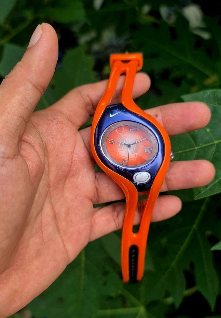 Nike Sports Watch (Category: Men's Watches) located in San Mateo. Submitted by gk2900504184839 (Listing ID 1465419877, Image 2). Description: - Brand: Nike Sports Watch - Design: Round metallic bezel with side push buttons and durable rubber strap - Display: Clear yellowish digital screen showing time and date - Durability: Water-resistant up to 100M - Best For: Running, workouts, and everyday casual wear - Condition: Ready for daily use.