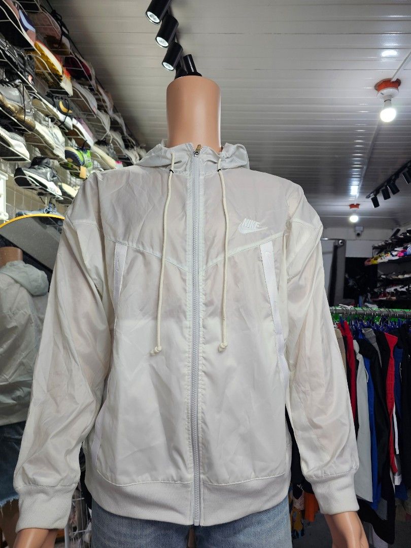 Nike Sportswear Windrunner full-zip hooded jacket (Category: Coats, Jackets and Outerwear) located in Baguio. Submitted by kayeonlineshop (Listing ID 1465430872, Image 2). Description: -Nike Sportswear Windrunner full-zip hooded jacket in a white or light-colored neutral tone featuring the classic chevron design lines..
