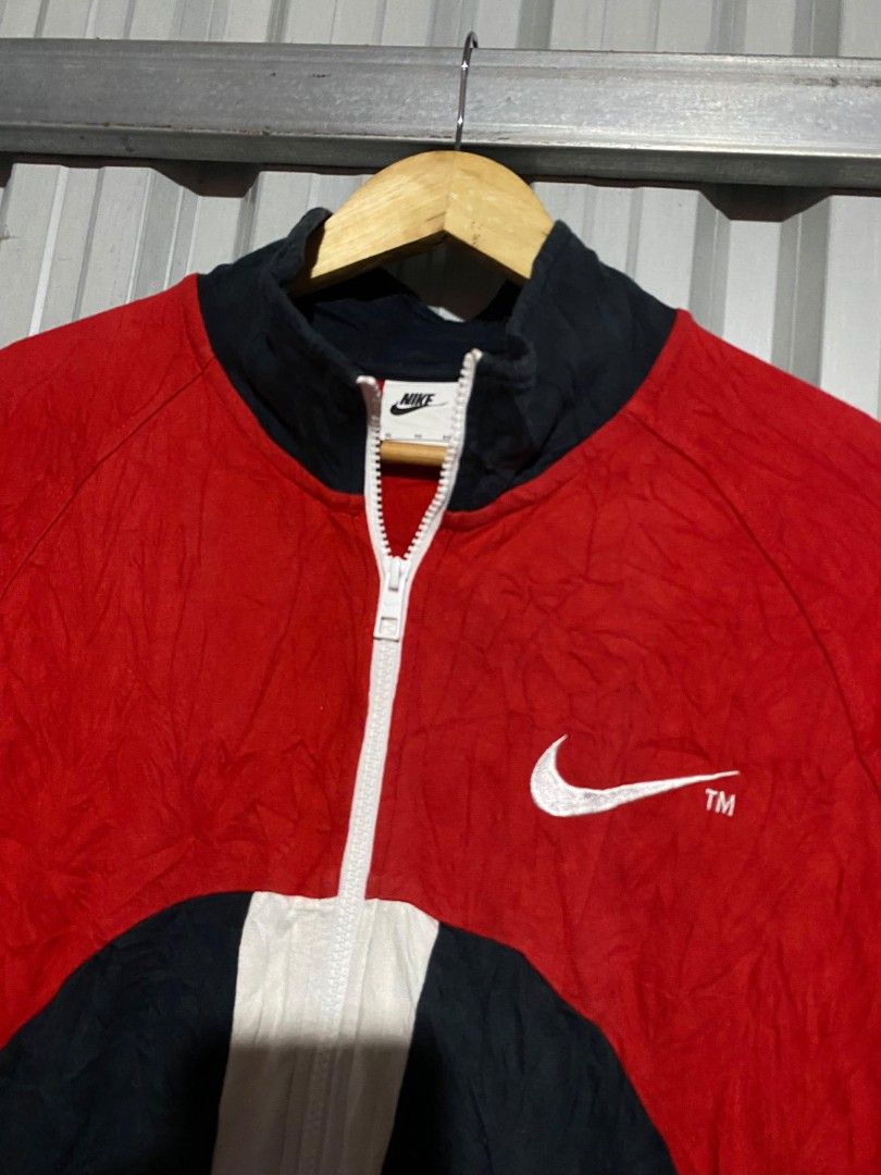 Nike Vintage Colorblock Full Zip Track Jacket (Category: Coats, Jackets and Outerwear) located in Bacolod City. Submitted by carlo1019 (Listing ID 1465385198, Image 3). Description: - Brand: Nike - Style: Full-zip colorblock jacket (Red/Black/White) - Size: XL - Details: High collar neckline, white Swoosh printed on chest and back, registered trademark text on rear lower panel - Style Code: DD5982-657 - Condition: 100% authentic and well-maintain